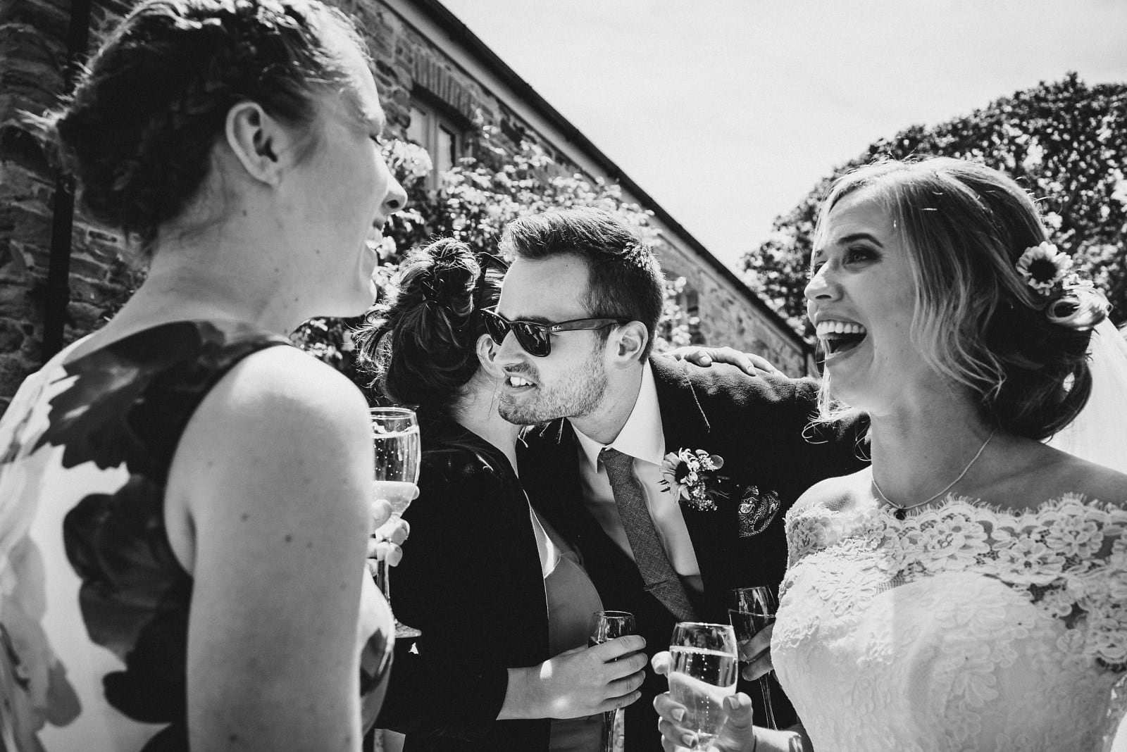 The guests and couple celebrate after their wedding ceremony at Nancarrow Farm